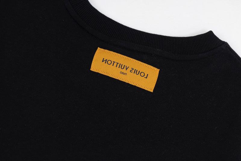 Side profile of Louis Vuitton luxury clothing with label-forward styling
