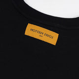 Side profile of Louis Vuitton luxury clothing with label-forward styling