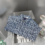 Flat lay presentation of Louis Vuitton luxury clothing with everyday silhouette