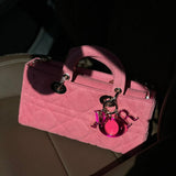 Handle and strap detail of refined elevated women's handbag – women's designer-style accessory