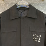 Flat lay presentation of Louis Vuitton luxury clothing with runway-inspired design