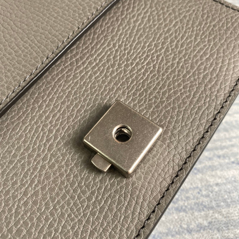 Close-up detail of classic structured women's handbag – women's designer-style accessory