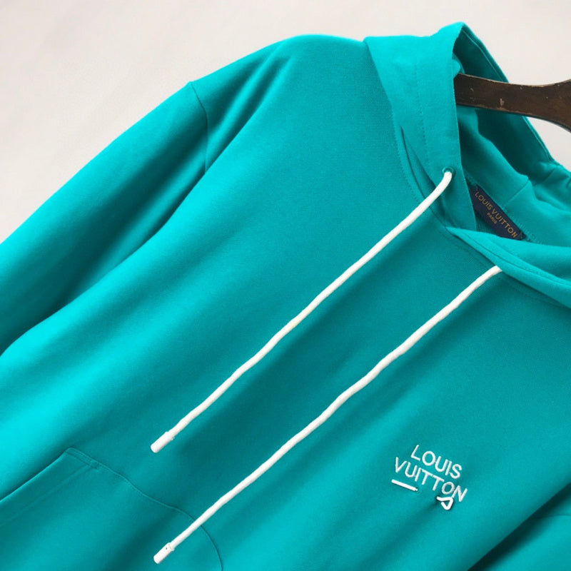 Flat lay presentation of Louis Vuitton luxury clothing with logo-detail design