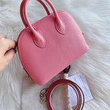 Side view of clean-lined structured handbag