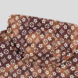 Flat lay presentation of Louis Vuitton luxury clothing with logo-detail design