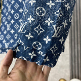 Side profile of Louis Vuitton luxury clothing with label-forward styling