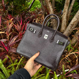 Side view of considered structured handbag