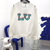 Front view of Louis Vuitton luxury clothing with runway-inspired design