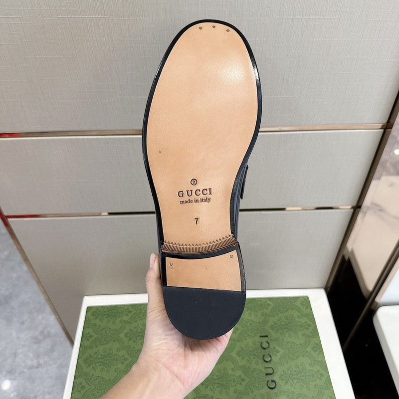 Side profile of Gucci tonal black sneakers bold athletic profile