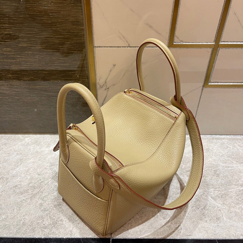 Side view of polished structured handbag