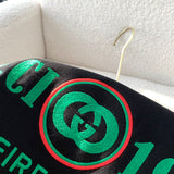 Close-up detail shot of Gucci luxury clothing with monogram-inspired silhouette