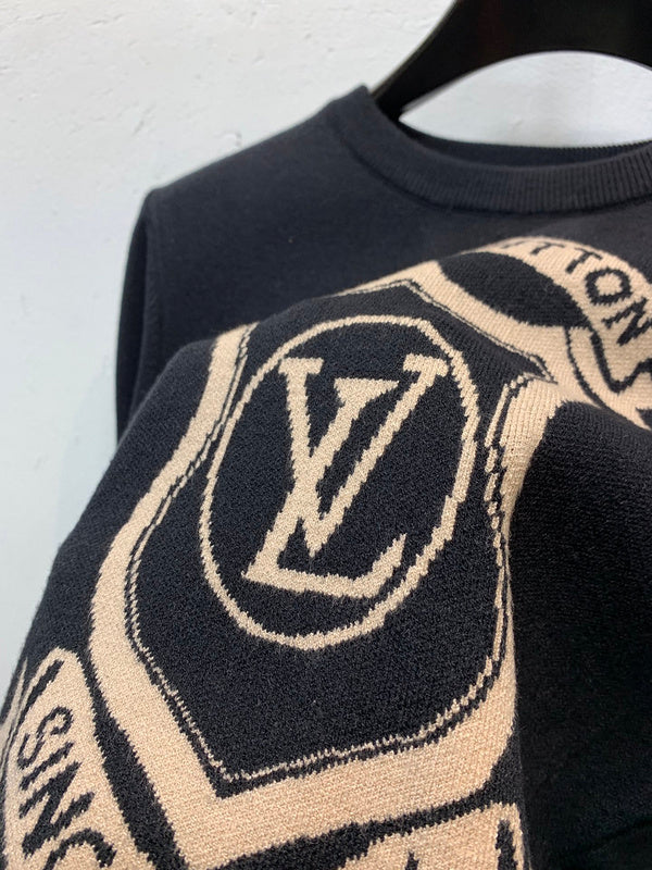 Front view of Louis Vuitton luxury clothing with label-forward styling