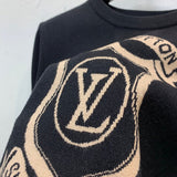 Front view of Louis Vuitton luxury clothing with label-forward styling