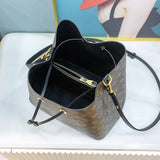 Side profile of classic refined women's handbag – women's statement bag