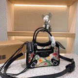Ziva's Charm handbag – close-up view (one versatile size)