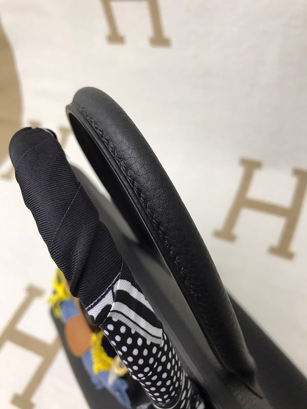 Side view of refined structured handbag