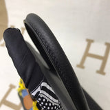 Side view of refined structured handbag