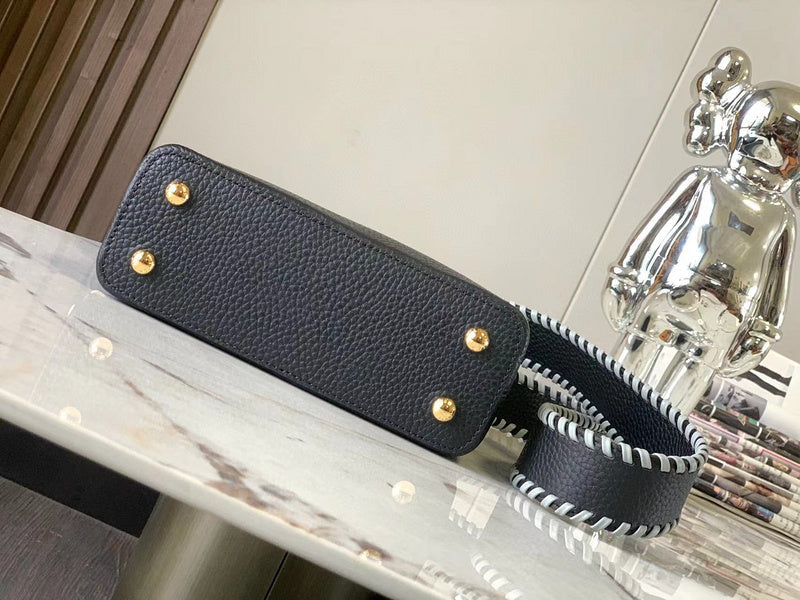 Styled lifestyle shot of polished structured women's handbag – women's luxury accessory