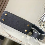 Styled lifestyle shot of polished structured women's handbag – women's luxury accessory