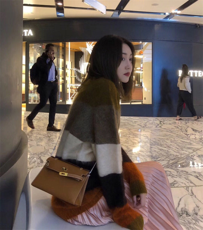 Side view of understated structured handbag