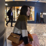 Side view of understated structured handbag
