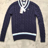 Full styled look of Lacoste luxury clothing with monogram-inspired silhouette