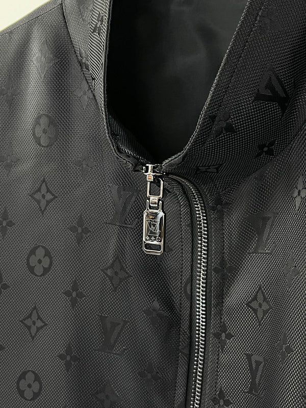Close-up detail shot of Louis Vuitton luxury clothing with label-forward styling