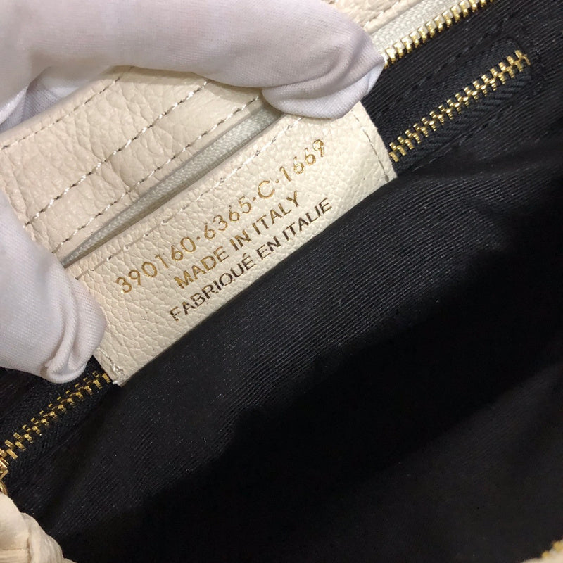 Side profile of modern statement women's handbag – women's luxury accessory