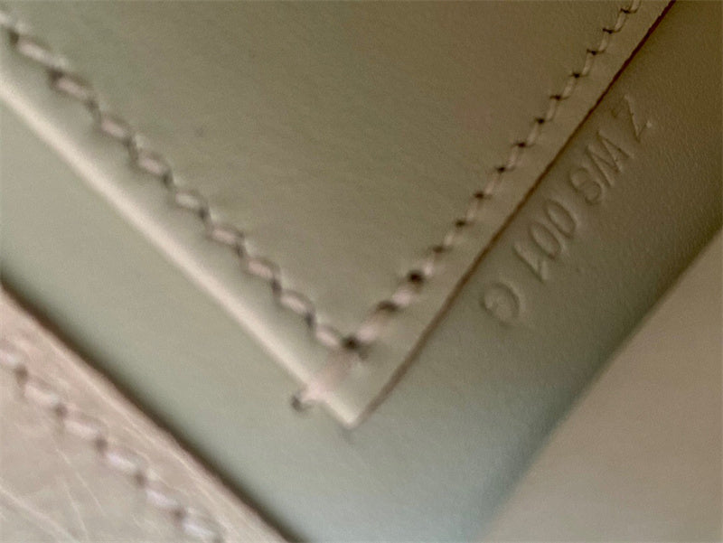 Side view of structured structured handbag