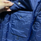 Front view of Louis Vuitton luxury clothing with label-forward styling
