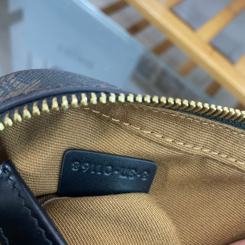 Side profile of structured classic women's handbag – women's luxury accessory