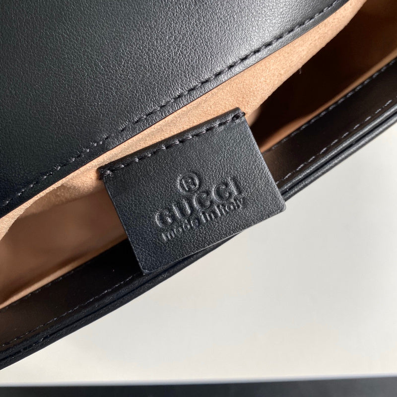 Side profile of chic polished women's handbag – women's designer-style accessory