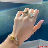 Lifestyle view of Van Cleef & Arpels unisex jewelry piece