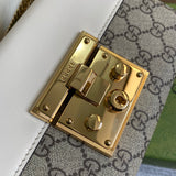 Styled lifestyle shot of refined structured women's handbag – women's luxury handbag