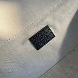 Side profile of chic signature women's handbag – women's luxury accessory