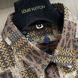 Close-up detail shot of Louis Vuitton luxury clothing with logo-detail design