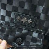 Flat lay presentation of Louis Vuitton luxury clothing with label-forward styling