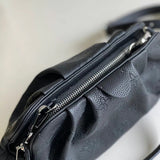 Close-up detail of structured everyday-luxe women's handbag – women's designer-style accessory