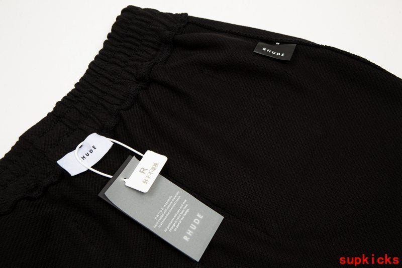 Close-up detail shot of Rhude luxury clothing with contemporary cut