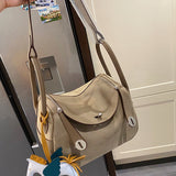Side view of fluid structured handbag