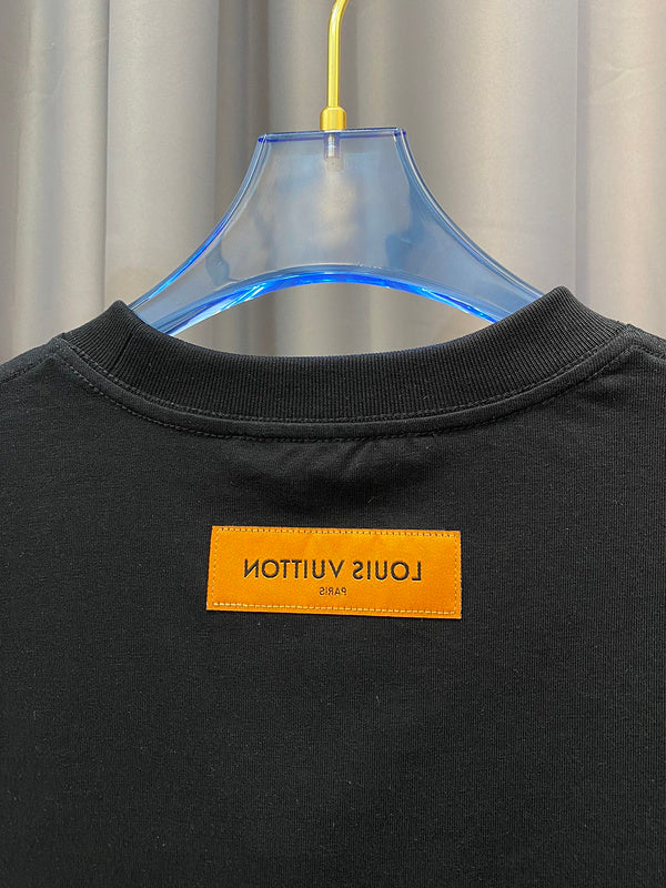 Close-up detail shot of Louis Vuitton cotton t-shirt with signature branding