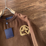 Full styled look of Louis Vuitton luxury clothing with logo-detail design