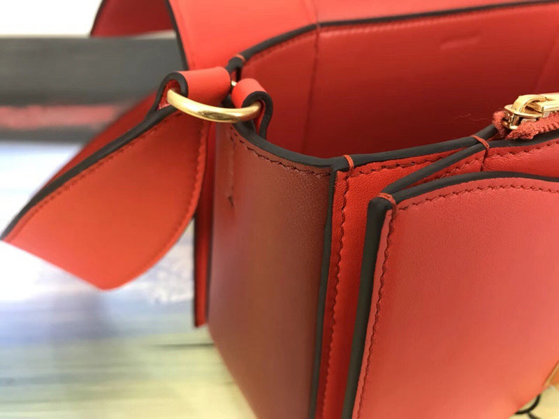 Handle and strap detail of classic polished women's handbag – women's luxury accessory