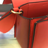 Handle and strap detail of classic polished women's handbag – women's luxury accessory