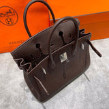 Side view of tailored structured handbag
