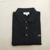 Flat lay presentation of Lacoste luxury clothing with signature branding