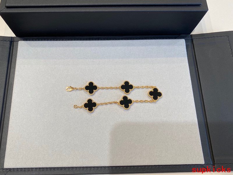 Lifestyle view of Van Cleef & Arpels unisex jewelry piece
