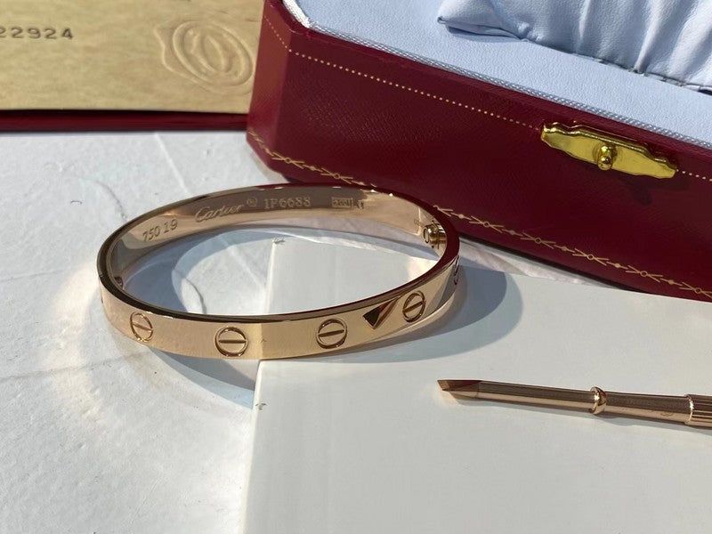 Side view of Cartier unisex jewelry piece