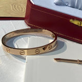 Side view of Cartier unisex jewelry piece