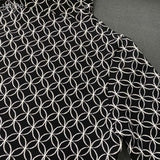Close-up detail shot of Louis Vuitton luxury clothing with contemporary cut